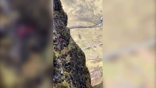This stunning video shows two daredevils base jumping off the narrowest ridge in the UK in a 'heart in mouth' moment