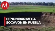 Reportan socavón de alrededor de 100 metros en campos de cultivo de Puebla