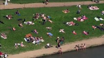 People take advantage of soaring temperatures to hit outdoor pools and beaches in London and Kent