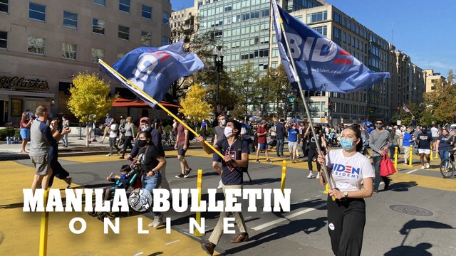People celebrate outside the White House as Joe Biden elected US president