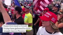 Armed Trump supporters gather outside vote count centre in Arizona