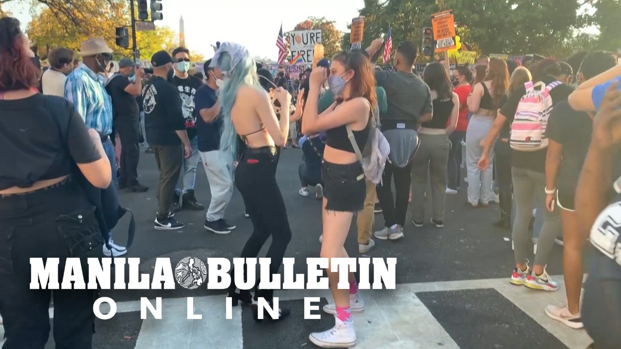 Americans dance near White House to celebrate Biden's victory