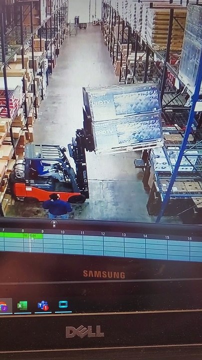 Pallet of TV's Fall onto Forklift Driver