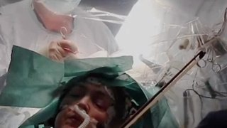 A Musician Plays The Violin During Brain Surgery