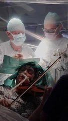 A Musician Plays The Violin During Brain Surgery