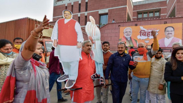 BJP workers celebrate victory with Modi-Nitish posters