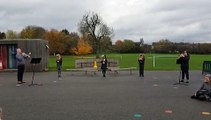 Pupils from Northampton primary school play The Last Post