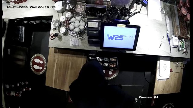 CCTV footage shows clumsy burglar fall while fleeing from police after smashing his way into Domino's and Costa