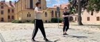 Guy Jumps Over Two Guys While They Pass Diabolo Skilfully to Each Other