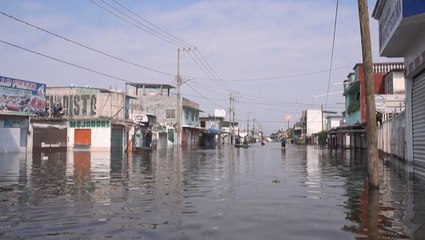 Floodwaters flow through towns after Eta