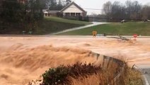 Rushing floodwaters overwhelmed washed-out road