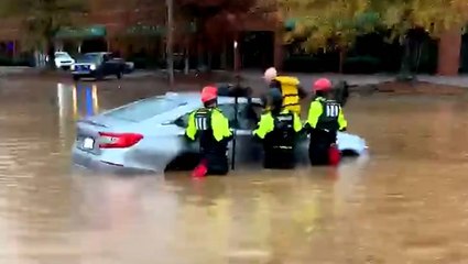 Rescue team frees man trapped inside flooded car