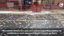 Moradores denunciam que carro passou jogando santinhos de candidato no meio da rua em André Carloni, na Serra