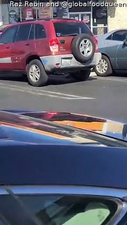 Woman Climbs Onto Car as Couple Argue