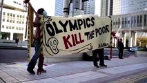 Olympics boss confronts Tokyo protesters