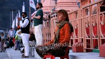 White woman meditates on banks of River Ganga - Rishikesh