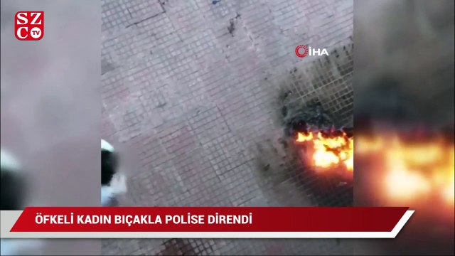 Öfkeli kadın bıçağı boynuna dayayıp ekiplere direndi