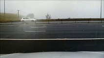 Watch the terrifying moment car goes sliding sideways on the M62 in front of police