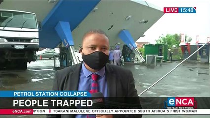 People trapped after petrol station collapse