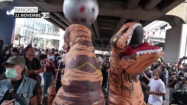 Thai students and dancing dinosaurs rally in Bangkok