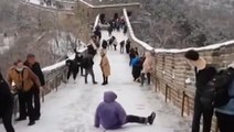 Tourist slides down Great Wall of China amid icy conditions