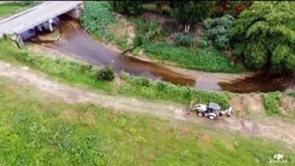 Tractor Takes Sand from River Embankment