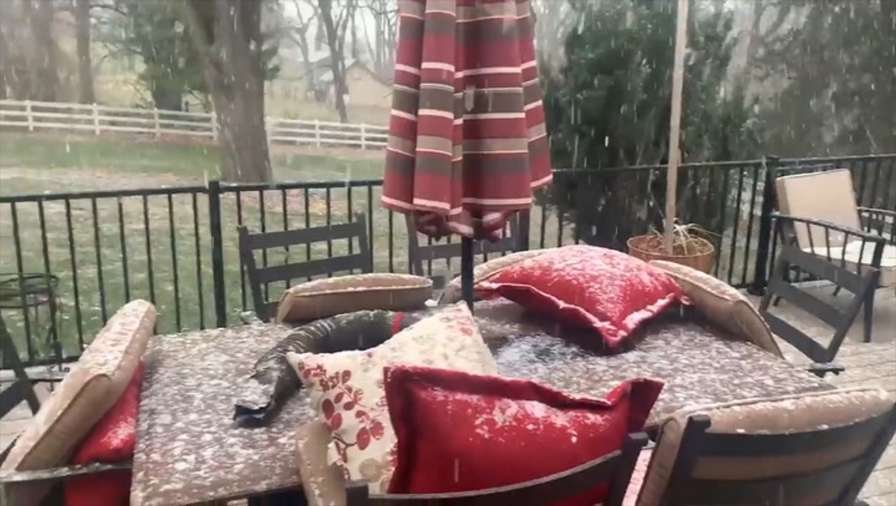 Fluffy flakes fall on patio in Nebraska