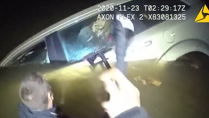 Police rescue woman from car sinking in cold river