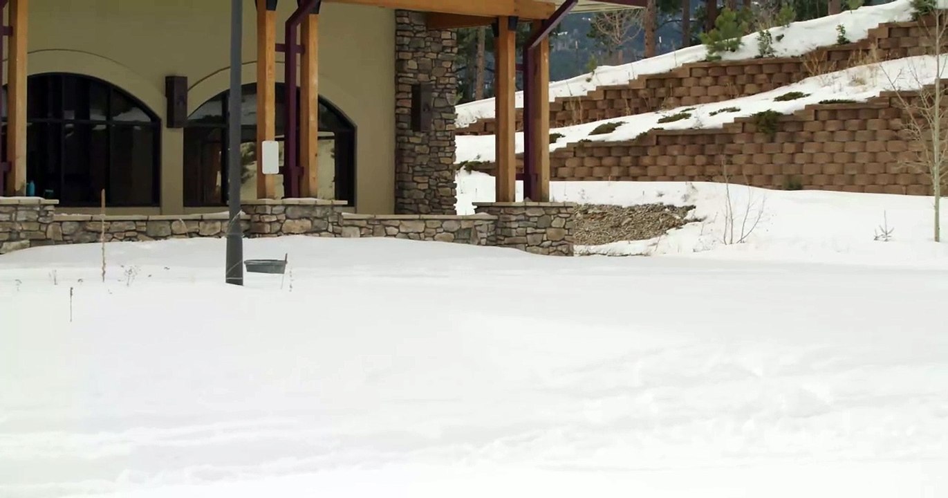 Guy On Skis Jumps Off Ramp And Falls After Landing On Handrail