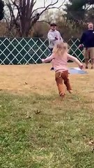 Little Girls Spins and Falls Down in Grass