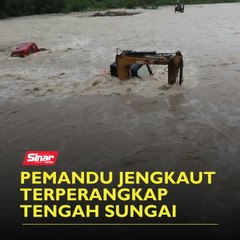 Pemandu jengkaut terperangkap tengah sungai