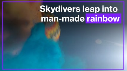 Skydivers leap into man-made rainbow