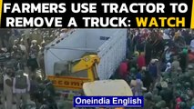 Farmers clashed with forces at Tikri border, removed a truck with a tractor: Watch | Oneindia News