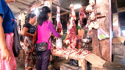 Women shop for prime cuts at meat market in Mizoram