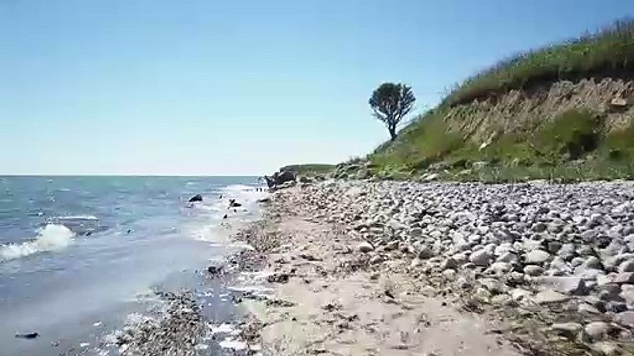 Small waves breaking on the coast Nature beautiful scene royalty Free  Stock no copyright background  video, creative common Free for commercial use, dron aerial view 4K- or full HD, in the world