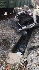 Aftermath of a Train Hitting the Back of a Car