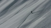 Skier Plows Through Snow Covered Path