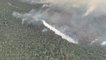 Crews dump suppressants on raging bushfire in Australia