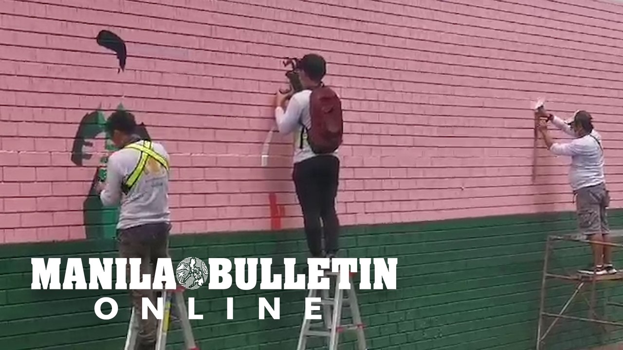 Freelance artists join together to paint a massive mural along Buendia