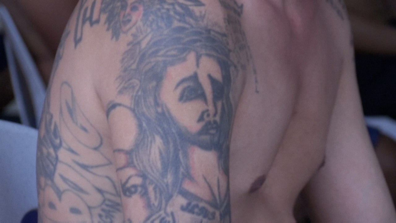 In the Philippines, gang tattoos of inmates are inked over by authorities to tackle jail violence