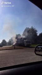 Garbage Truck Dumps Burning Load into Fire Station Parking Lot