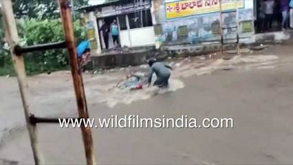 Truck weight brings down bridge_ Roads submerged, motorbike carried away by Telangana floodwaters