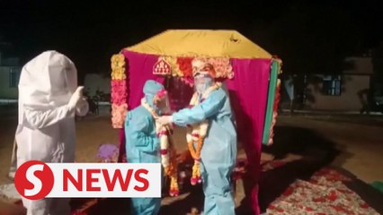 Indian couple ties knot in PPEs after bride tests positive for Covid-19
