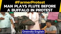 Noida: Man plays flute before a buffalo in protest against the farm laws: Watch| Oneindia News