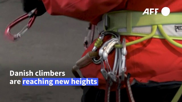 Thrill-seekers reach dizzying heights on world's highest climbing wall