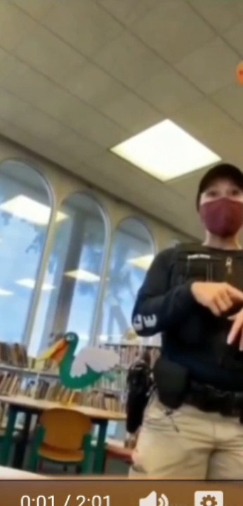 Communist cop harasses mother in the librsry