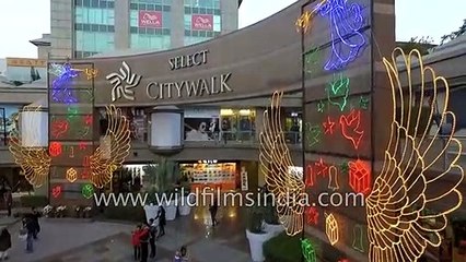 Giant Christmas tree and Indian flag at mall in New Delhi_ aerial journey