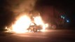 Car catches fire after colliding with container