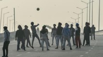 Farmers play volleyball at Singhu Border