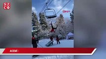 Rusya'da fünikülere takılan acemi kayakçının zor anları kamerada